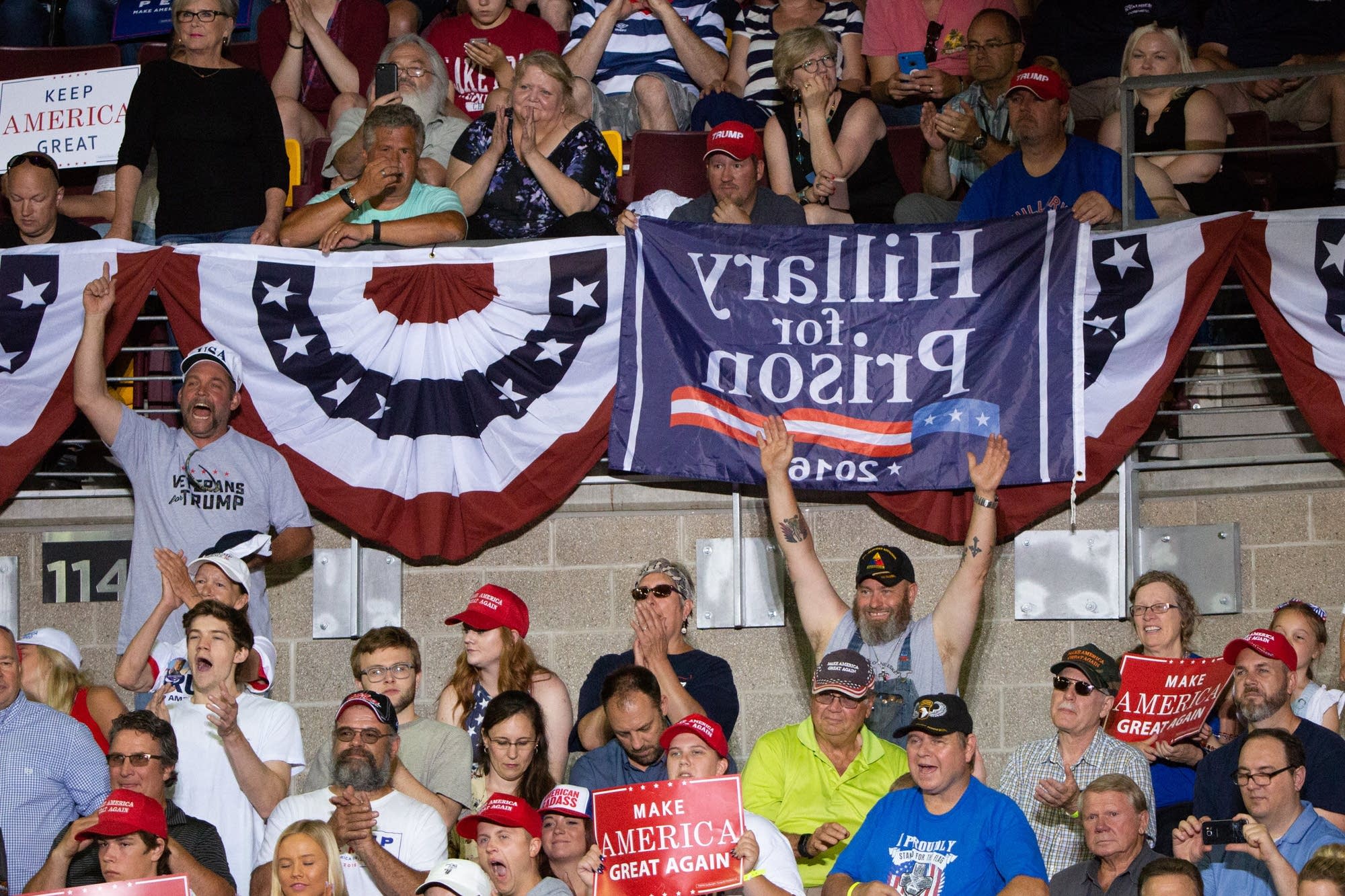 Supporters of President Trump cheer in the stands of Amsoil Arena.
