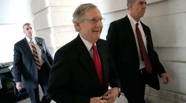 Senate Minority Leader Mitch McConnell (R-KY) (C) arrives at the U.S. Capitol October 15, 2013 in Washington, DC. The U.S. government shutdown is entering its fifteenth day as the U.S. Senate and House of Representatives remain gridlocked on funding the federal government. 