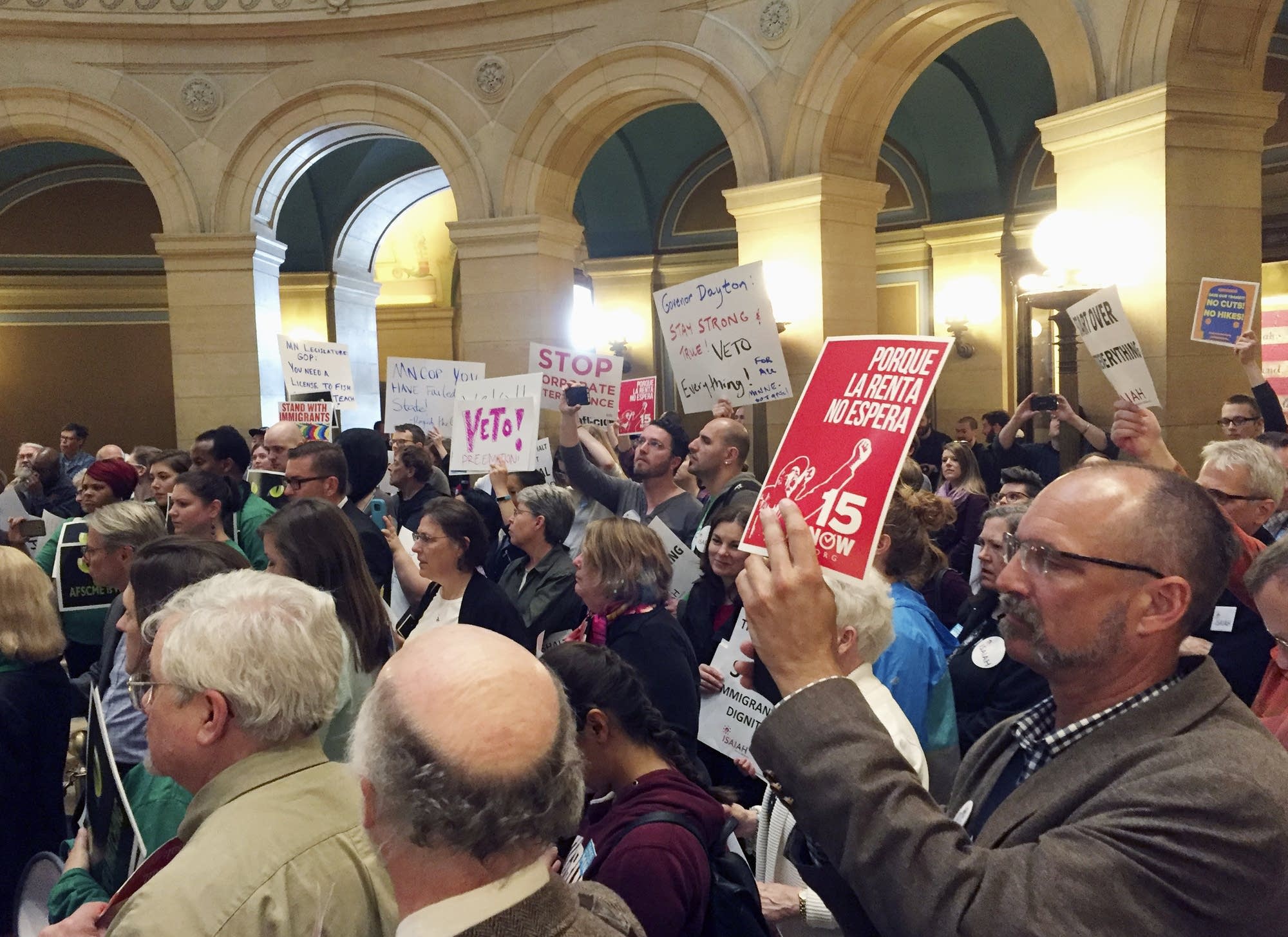 Protesters from labor and other progressive groups fill the rotunda Wed.