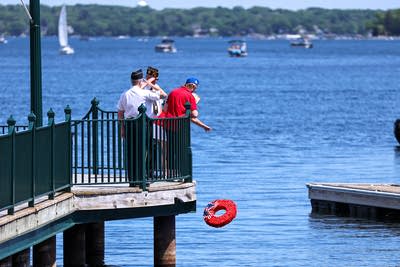VFW post 1782 members throw a wreath into the water 