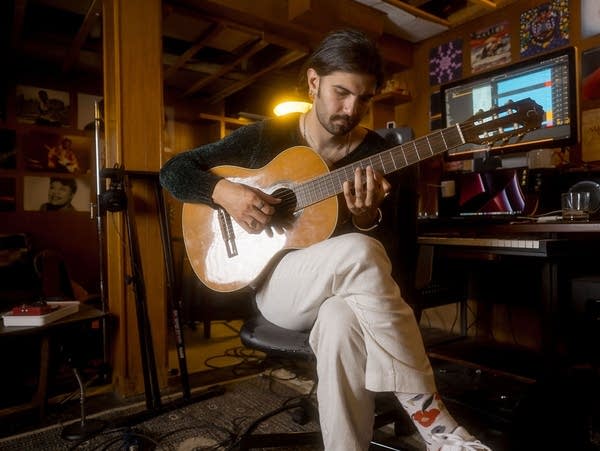Local producer Zak Khan and musician Kinfu work on music in Khan's South Minneapolis studio.