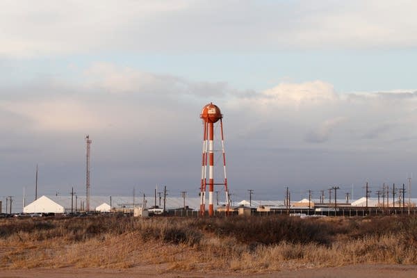 the outside of an ICE detention facility in the desert