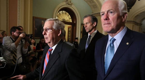 Senate Majority Leader Mitch McConnell, a Republican from Kentucky, speaks to reporters Tuesday at the Capitol about the tax reform bill the Senate passed last week.