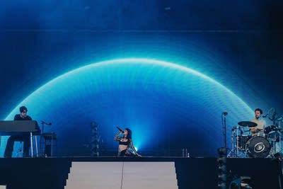A band performing on a large outdoor stage