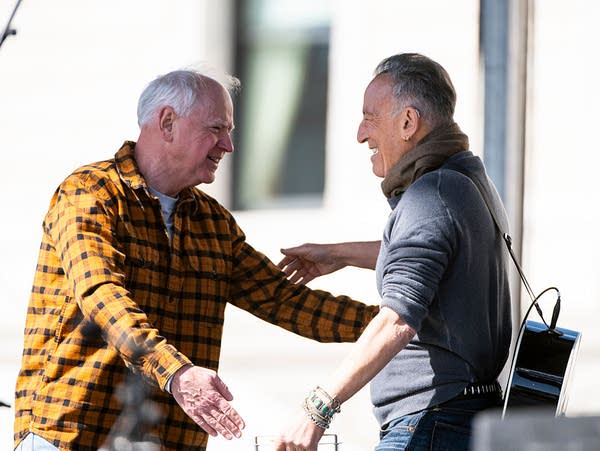 Minnesota Gov. Tim Walz introduces musician Bruce Springsteen during a "No Kings" protest outside the State Capitol building on March 28, 2026, in St Paul, Minnesota. 