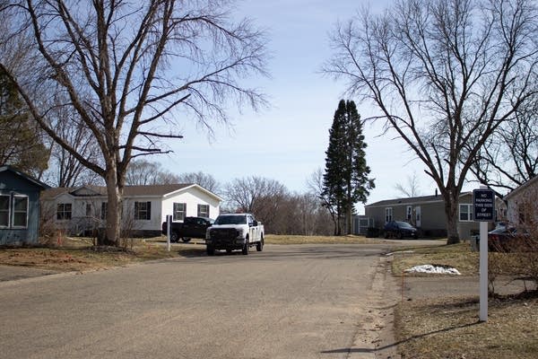 A car sits in a small community cul-de-sac.