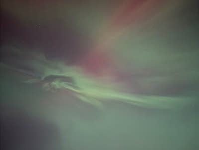 Green and red lights cover the sky.