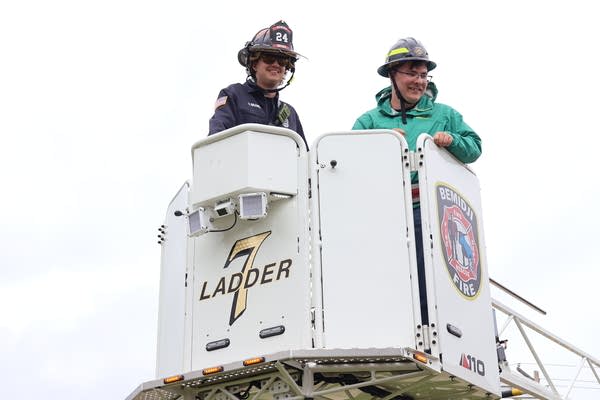 Two people in aerial basket