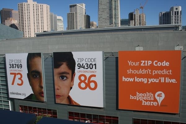 City sign says "Zip Code Shouldn't Predict how long you live"