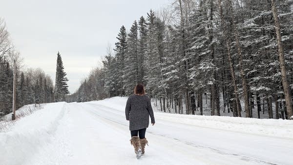 Olivia, an occupational therapist in northern Minnesota, walks by her client's home. The family decided to cancel their 18-month-old son's upcoming specialist appointments out of fear that they could be racially profiled and detained while traveling to the appointments in the Twin Cities.