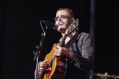 wild horses band playing on an outdoor stage