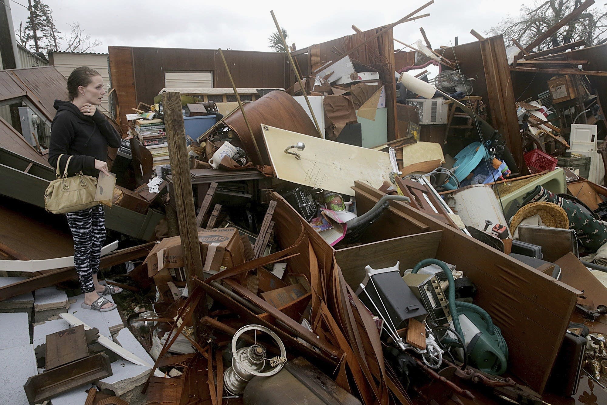 Haley Nelson inspects damages to her family properties.