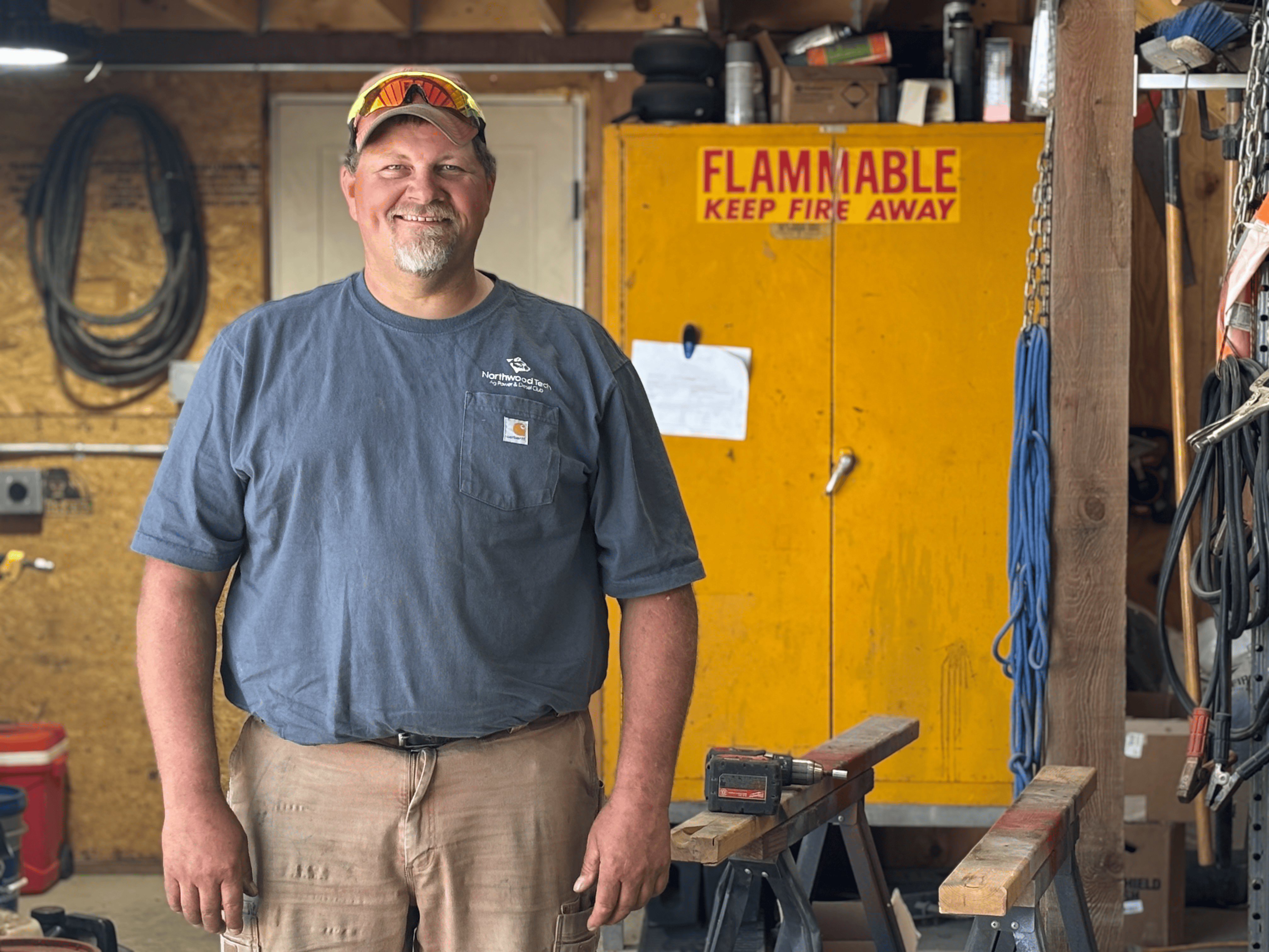 Jason Lohmann stands inside his barn