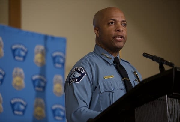 A man stands in front of a microphone.