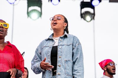 Known MPLS performing on an outdoor stage.