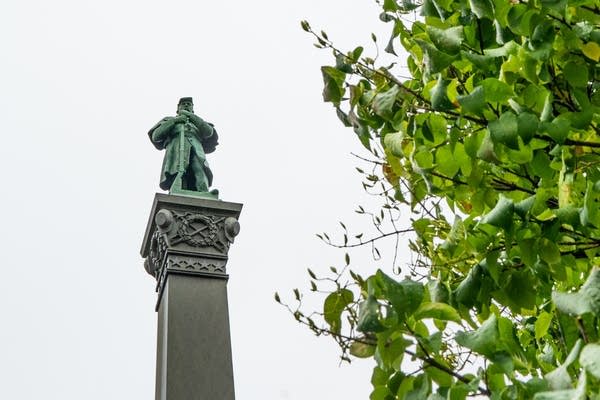 A statue of Josias King sits outside of the Cathedral of St. Paul.