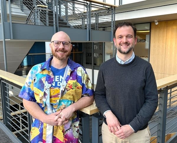 two men posing for a portrait