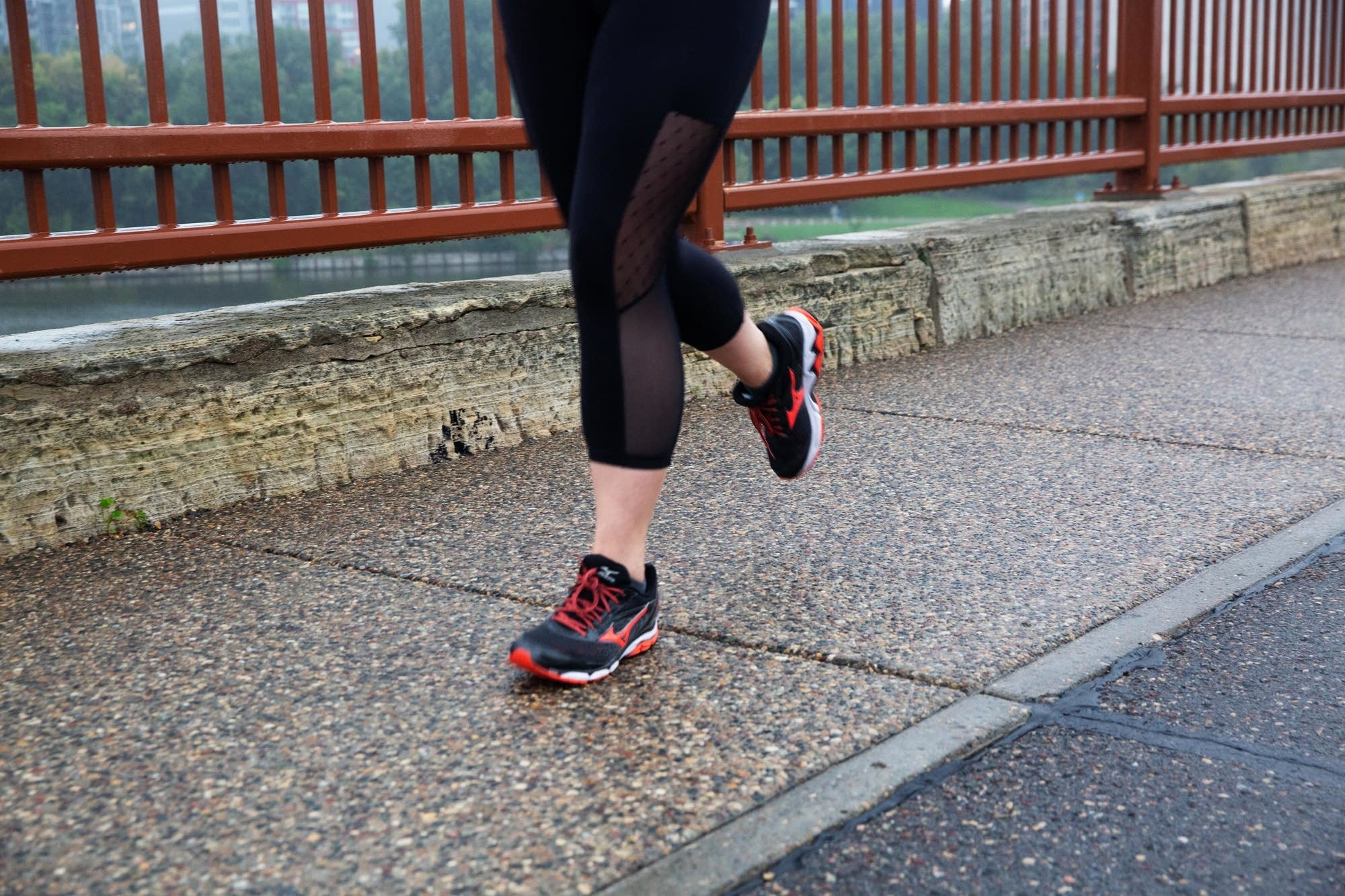 Angie Norvitch runs on the Stone Arch Bridge.