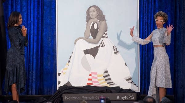 Former First Lady Michelle Obama, left, and artist Amy Sherald unveil Obama's portrait at the Smithsonian's National Portrait Gallery in Washington, D.C., Monday.