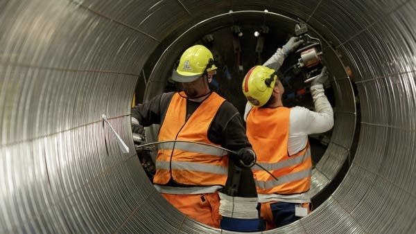 Workers building a section of the wall of the Nord Stream 2. 