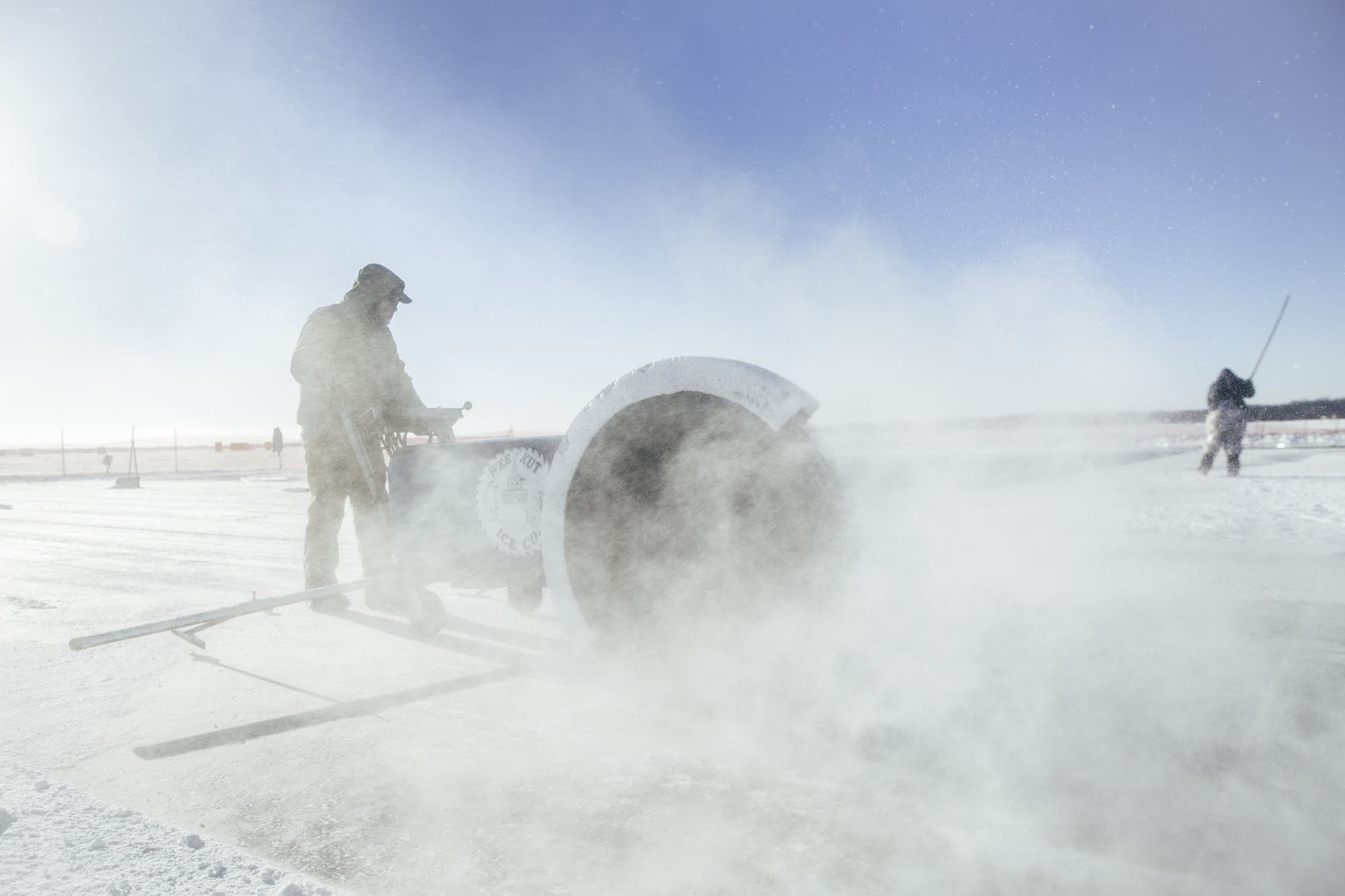 A Wee Kut Ice worker uses custom made ice cutter