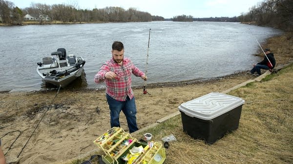 Thomas Struntz gets his gear ready along the Mississippi