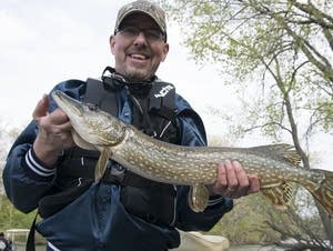 Jim Jahnke holds a northern pike he caught on Fountain Lake.