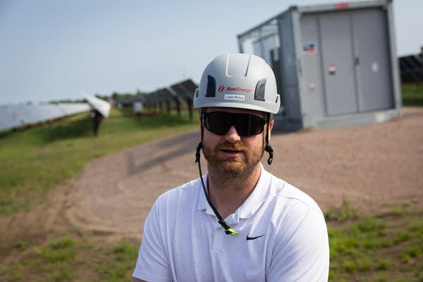 A man wears a hard hat