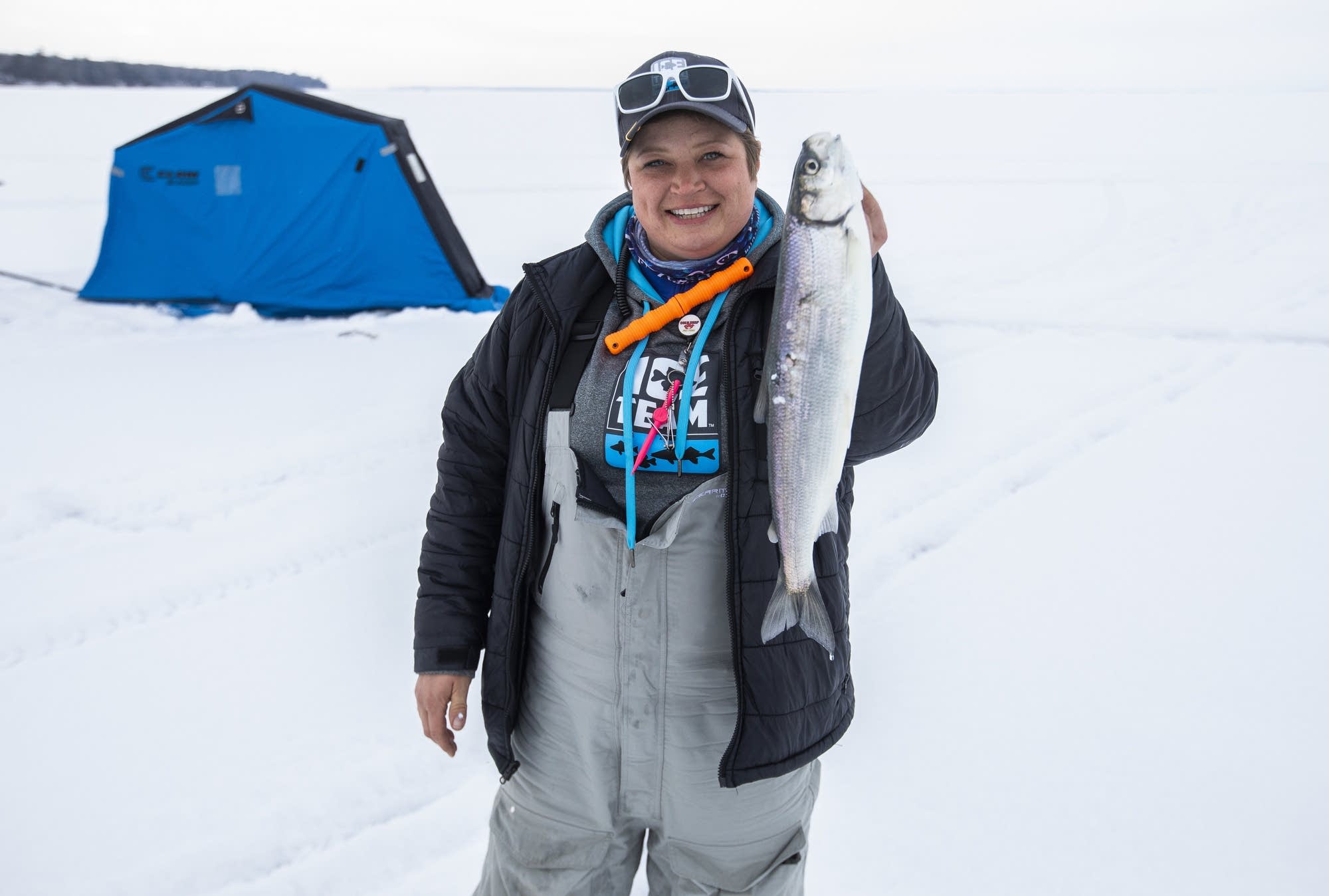 Rikki Pardun shows off a fish she caught.