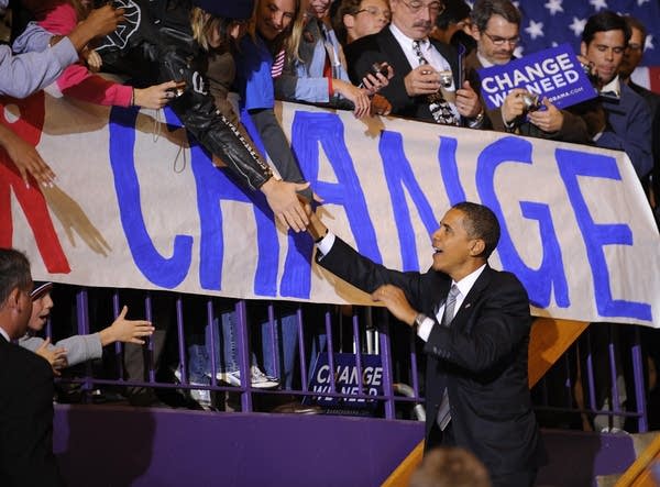 Barack Obama shakes hands with supporters