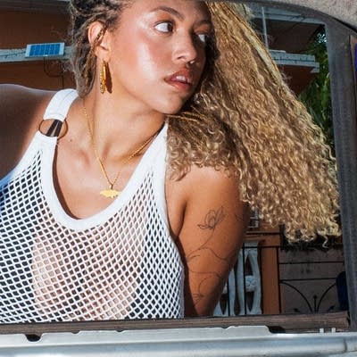 A woman looks over her shoulder