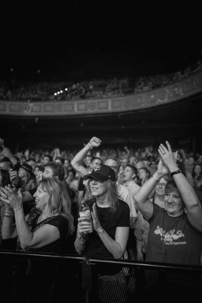 Music fans cheer and applaud