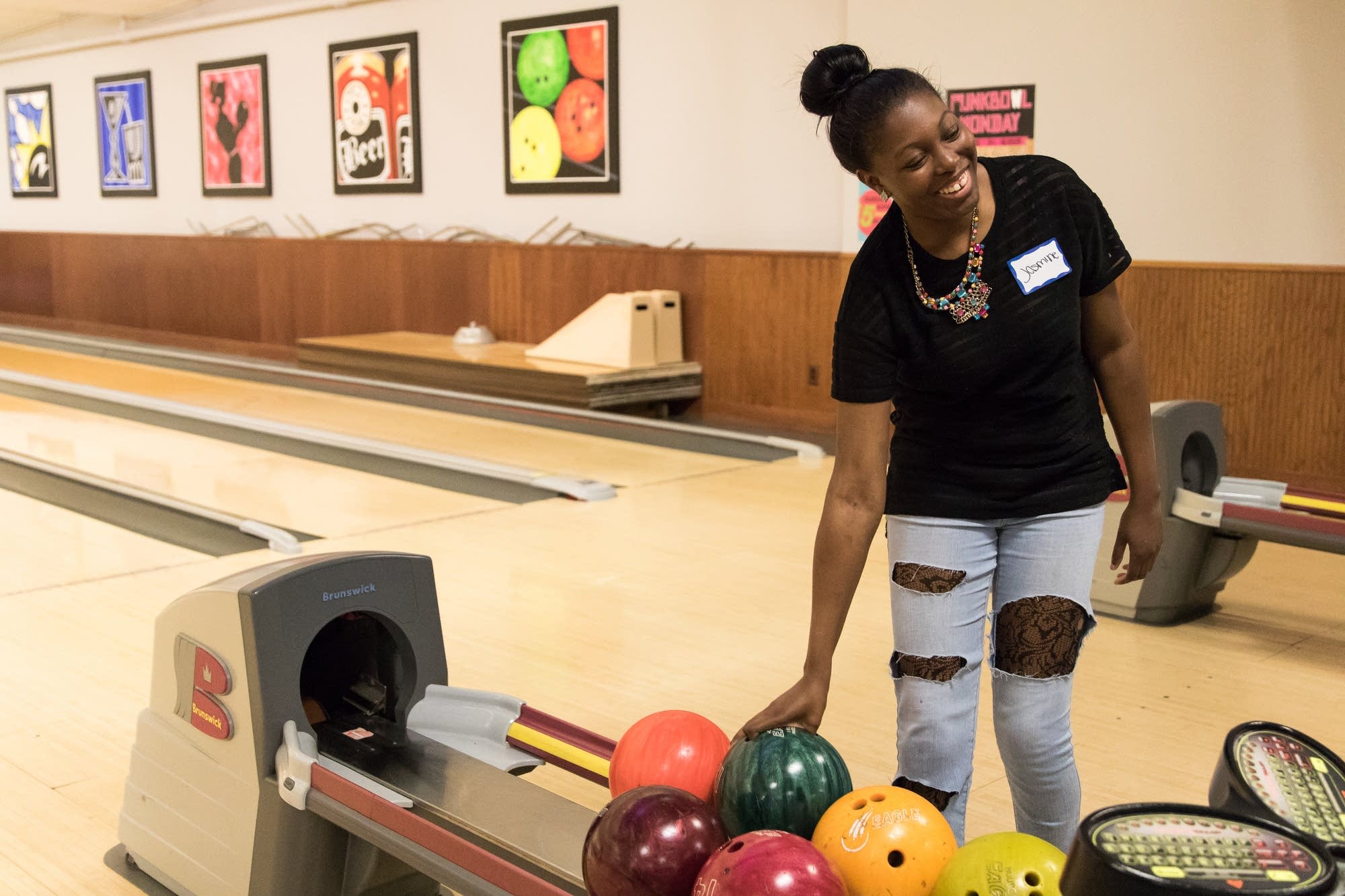 Jasmine Toliver, 21, laughs as other attendees cheer her on.