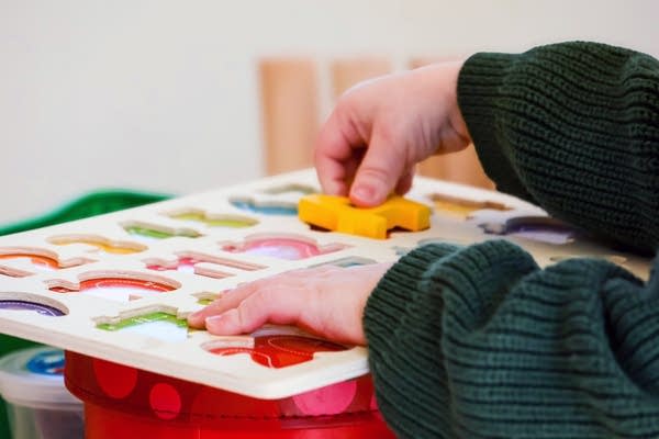 Child playing with a puzzle