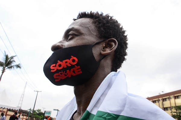 A curfew in the financial center of Lagos was delayed to allow people return home.