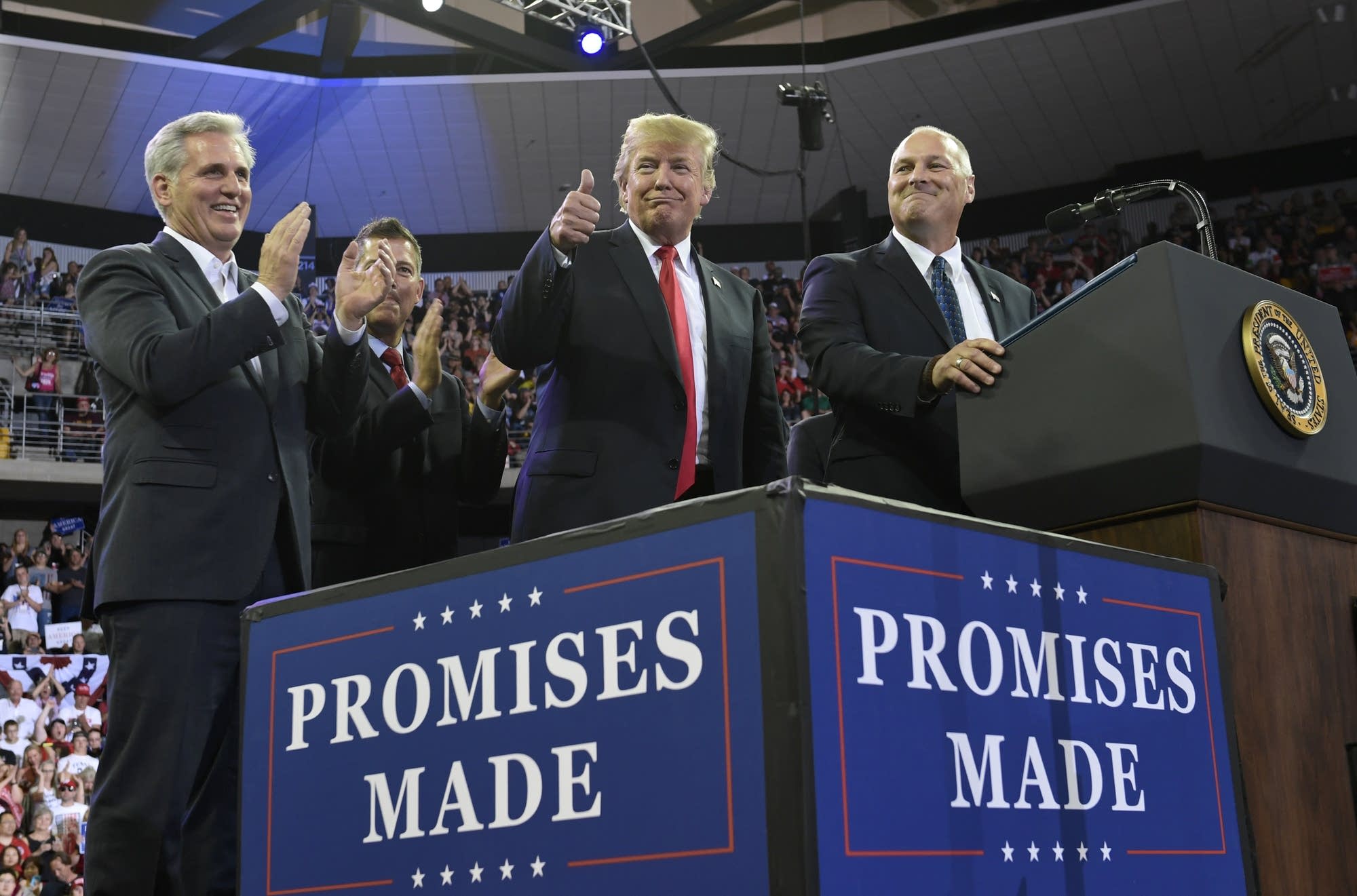 President Donald Trump gives a thumbs up.