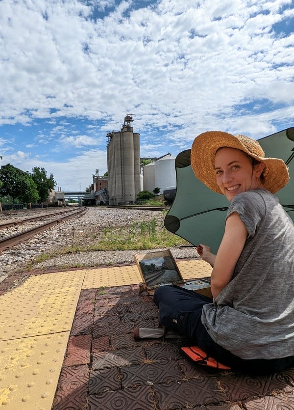 A person smiles for a photo