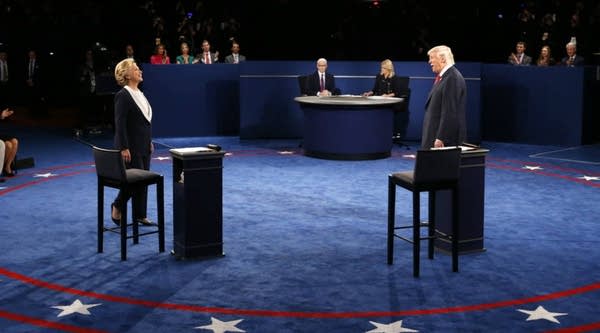 Democratic nominee Hillary Clinton and Republican nominee Donald Trump arrive on stage during the second presidential debate at Washington University in St. Louis, Missouri on Sunday.