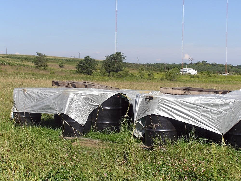 Barrels containing soil