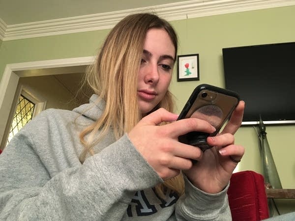 Laurel Foster holds her phone in San Francisco