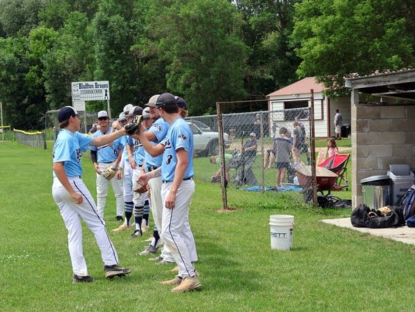 a line of baseball players in uniform