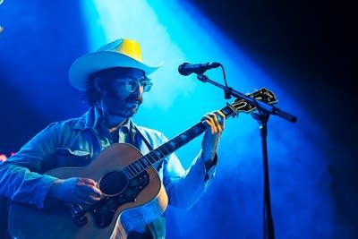 Band member performing on stage