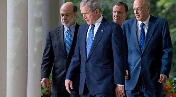 President Bush walks with, from left, Federal Reserve Chairman Ben Bernanke, Securities and Exchange Commission Chairman Christopher Cox, and Treasury Secretary Henry Paulson at the White House prior to Bush's statement on the economy today.