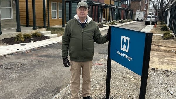 Chris Wilson stands in front of Hope Village in Baltimore