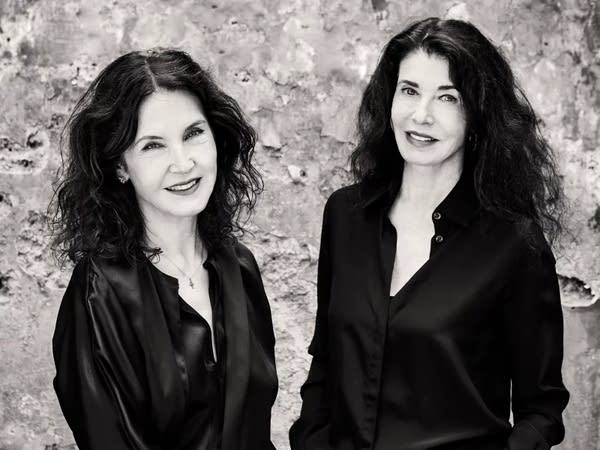 Poster Pianists Katia and Marielle Labeque in black shirts