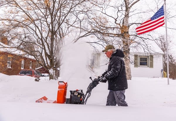 snowblowing a sidewalk