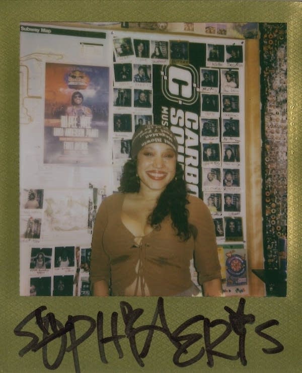 sophia eris posing for a polaroid photo