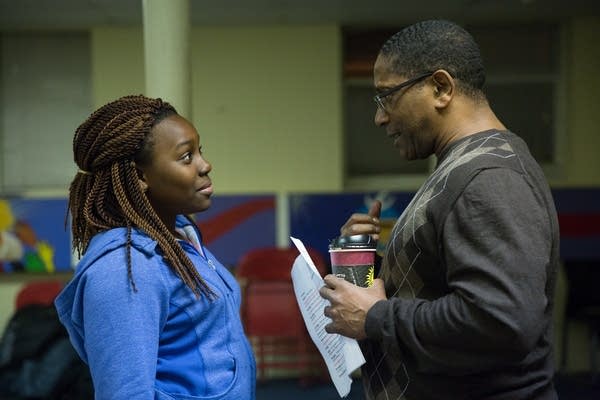 Brian Grandison coaches ten-year-old Shalom. 