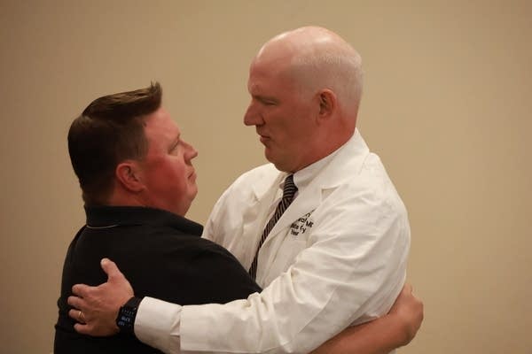 man hugging doctor