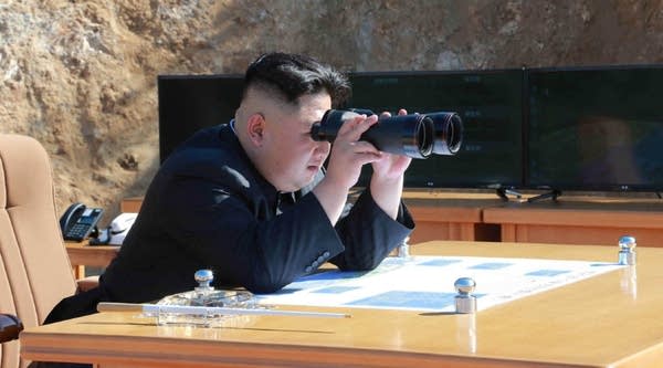 This picture taken and released on July 4, 2017 by North Korea's official Korean Central News Agency (KCNA) shows North Korean leader Kim Jong-Un inspecting the test-fire of intercontinental ballistic missile Hwasong-14 at an undisclosed location.